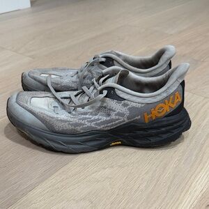 Hoka Gray and Black Athletic Shoes with Orange Accents